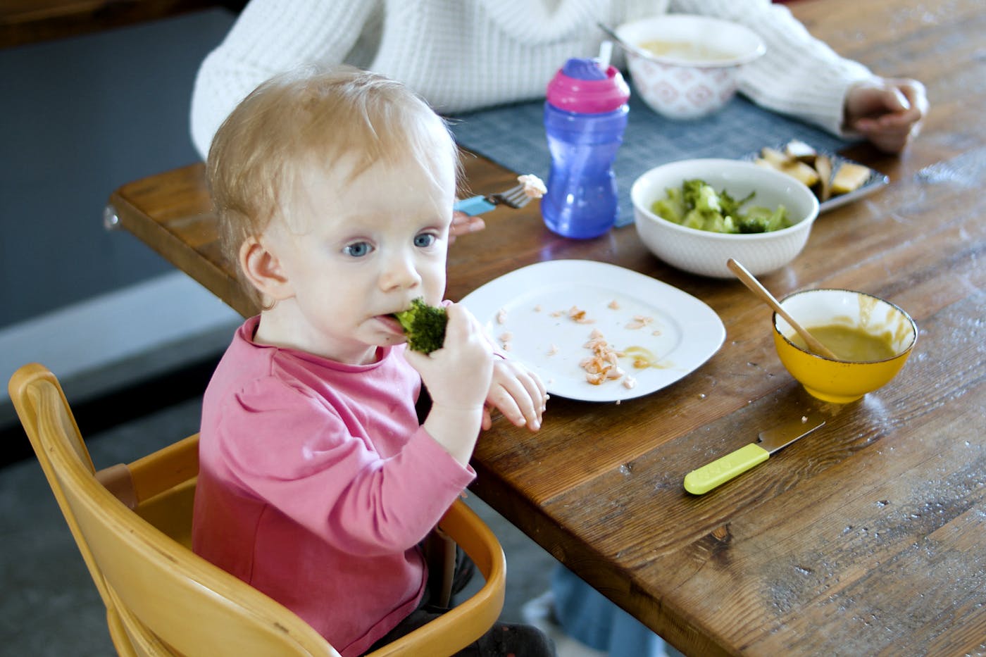 A Kid Sitting on the High Chair
